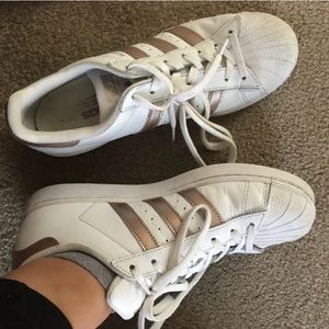 Rose gold Adidas Superstar sneakers